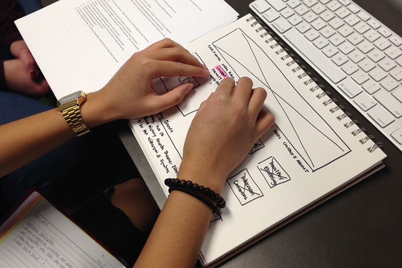 Student interacting with a paper prototype
